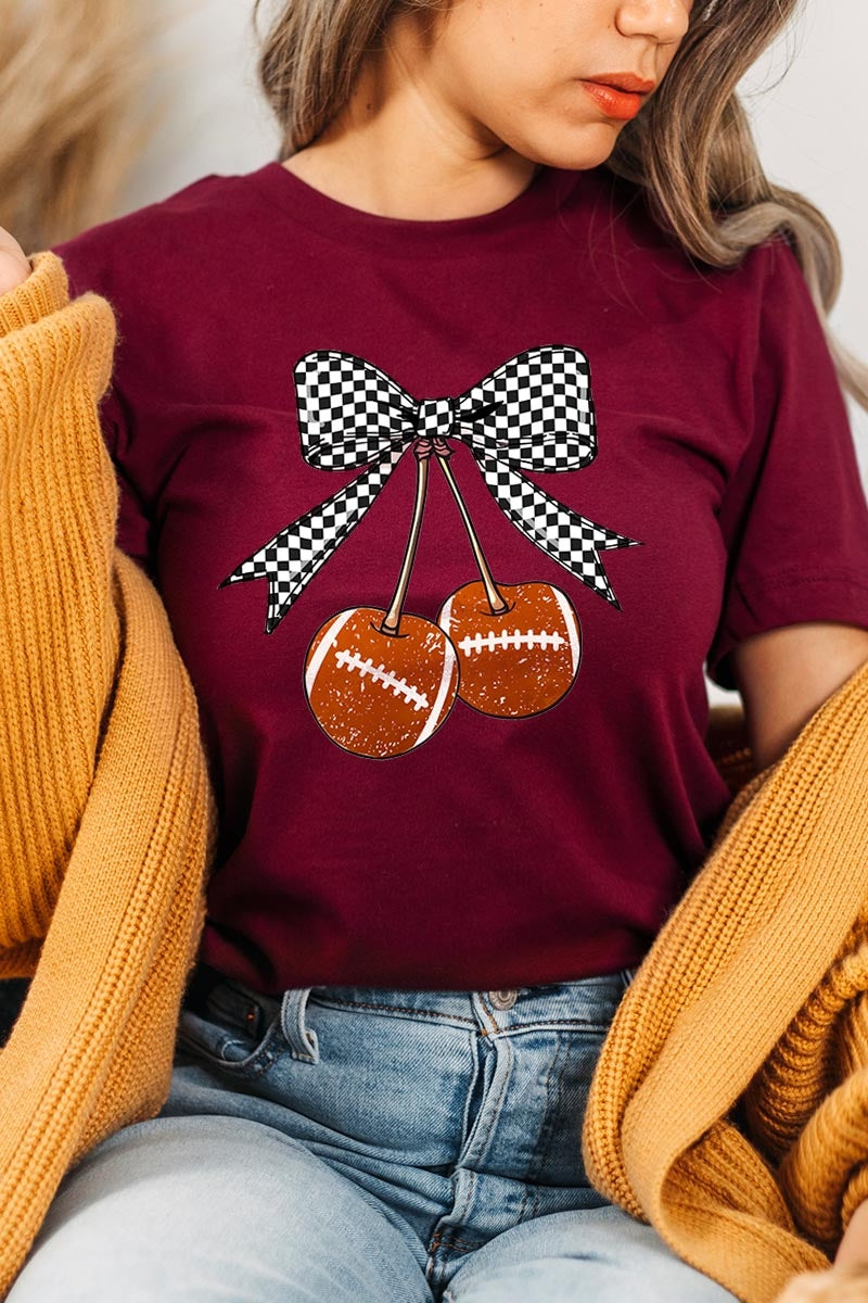 US3001P-E3055 Football Cherries Graphic Plus Tee $16