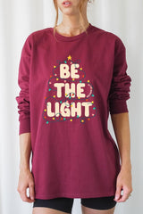 UL240-E3202 Be the Light Christmas Graphic Long Sleeve Tee $13.75