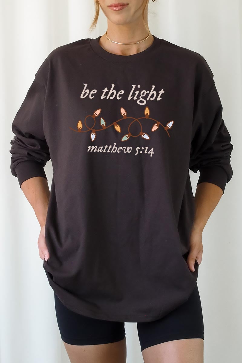 UL240-E3214 Be the Light Christian Graphic Long Sleeve Tee $13.75
