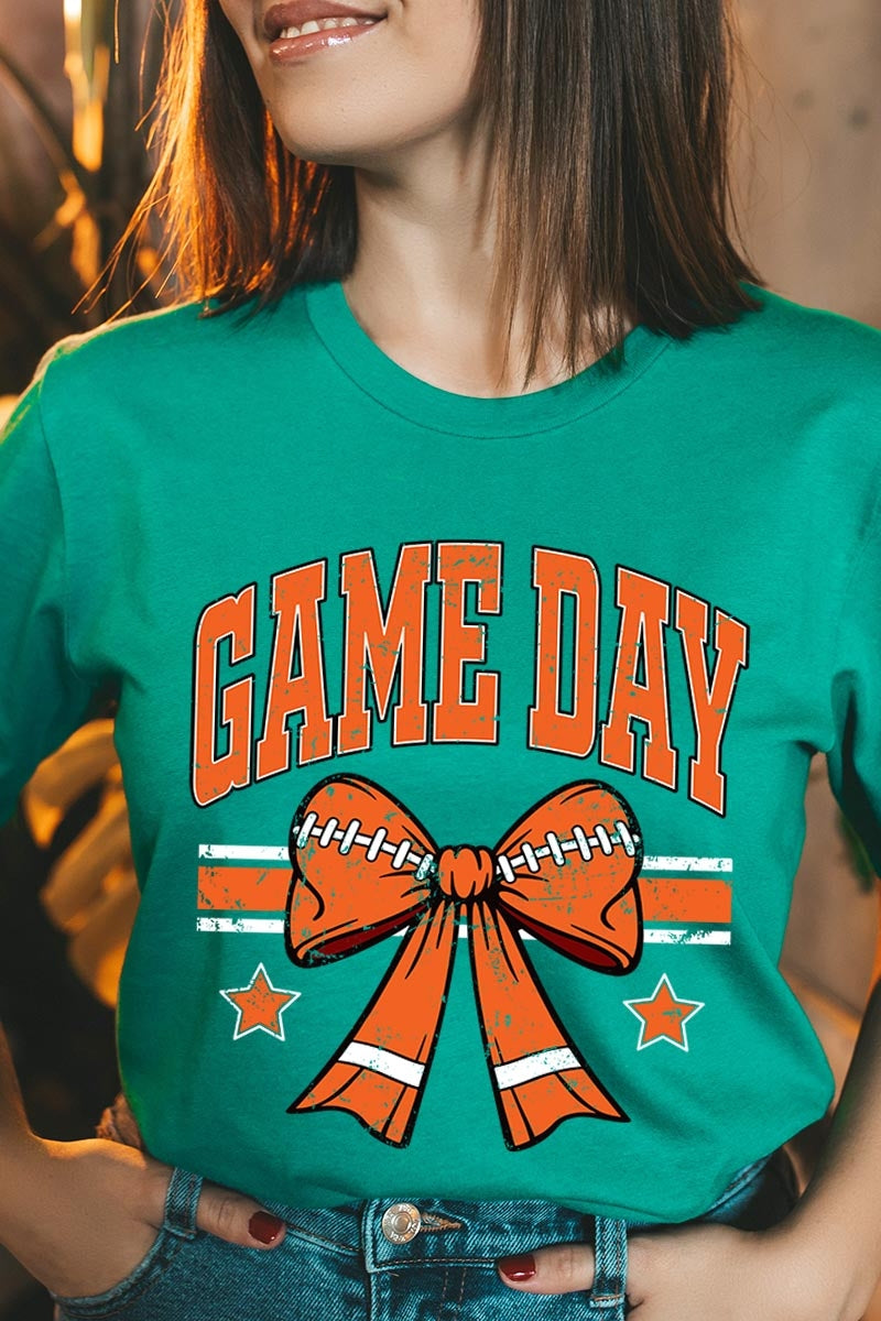 US3001P-E3064 Orange Game Day Football Bow Graphic Plus Tee $16
