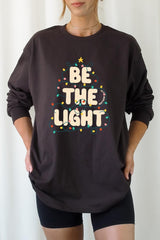 UL240P-E3202 Be the Light Christmas Graphic Plus Long Sleeve Tee $17