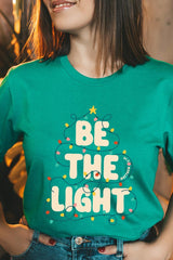 US3001P-E3202 Be the Light Christmas Graphic Plus Tee $16