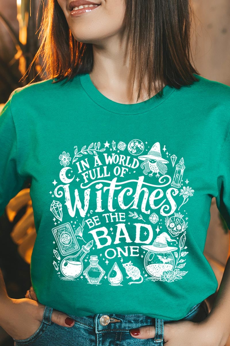 US3001-E3139 In a World of Witches Graphic Tee $12.5