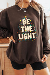 UL180P-E3202 Be the Light Christmas Graphic Plus Sweatshirt $25