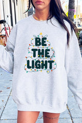 UL180P-E3202 Be the Light Christmas Graphic Plus Sweatshirt $25