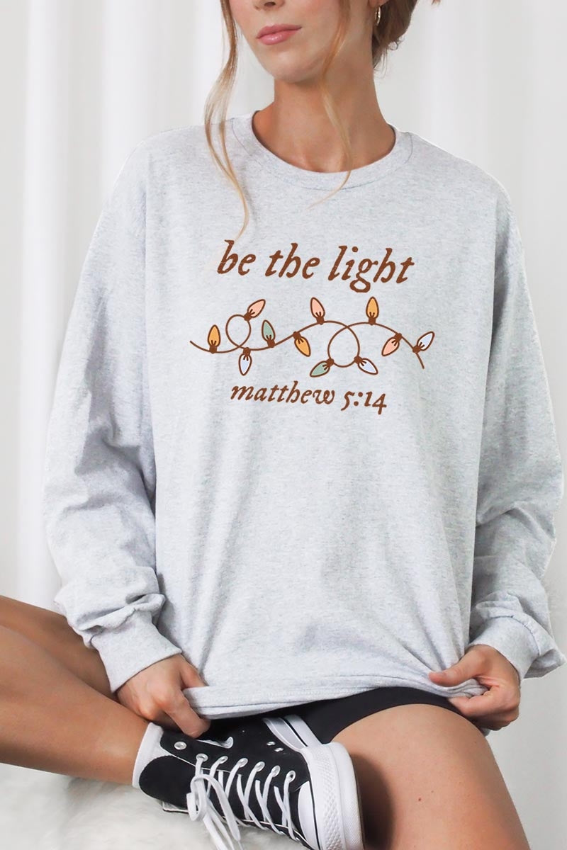UL240-E3214 Be the Light Christian Graphic Long Sleeve Tee $13.75