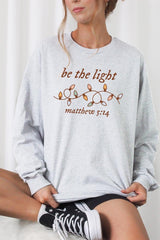 UL240-E3214 Be the Light Christian Graphic Long Sleeve Tee $13.75