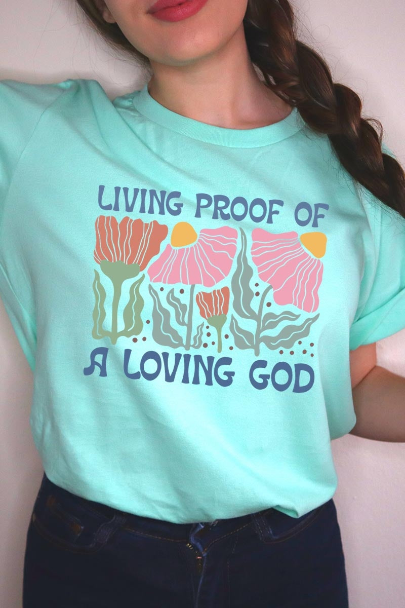 US3001P-E3066 Living Proof of a Loving God Graphic Plus Tee $16