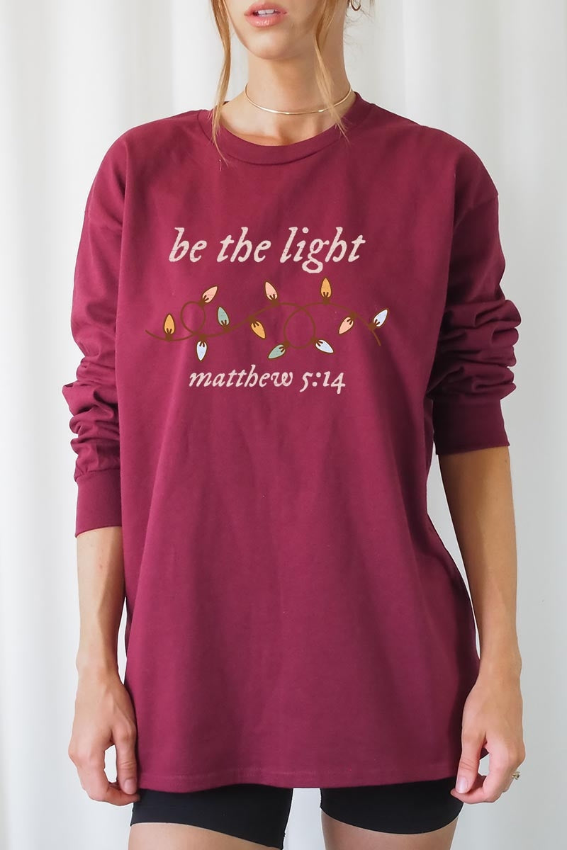 UL240-E3214 Be the Light Christian Graphic Long Sleeve Tee $13.75