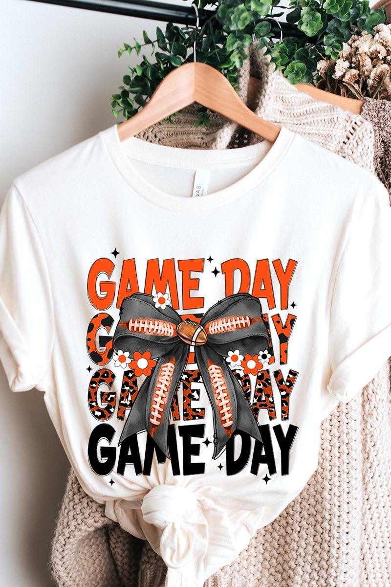 US3001-E3088 Orange Black Football Game Day Bow Graphic Tee $12.5