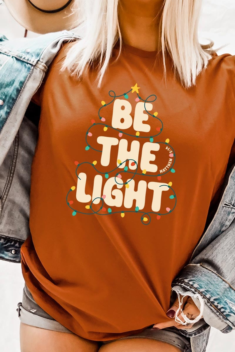 US3001P-E3202 Be the Light Christmas Graphic Plus Tee $16