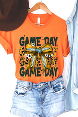 US3001P-E3090 Yellow Football Game Day Bow Graphic Plus Tee $16
