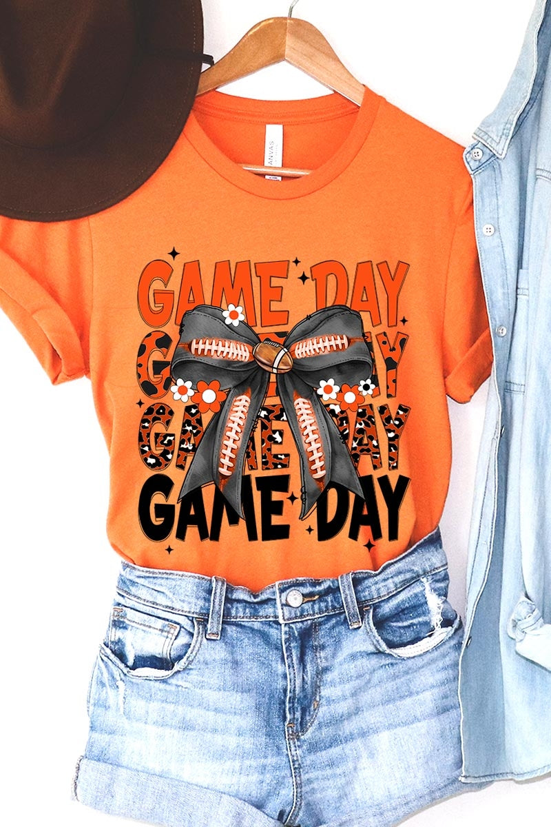 US3001-E3088 Orange Black Football Game Day Bow Graphic Tee $12.5