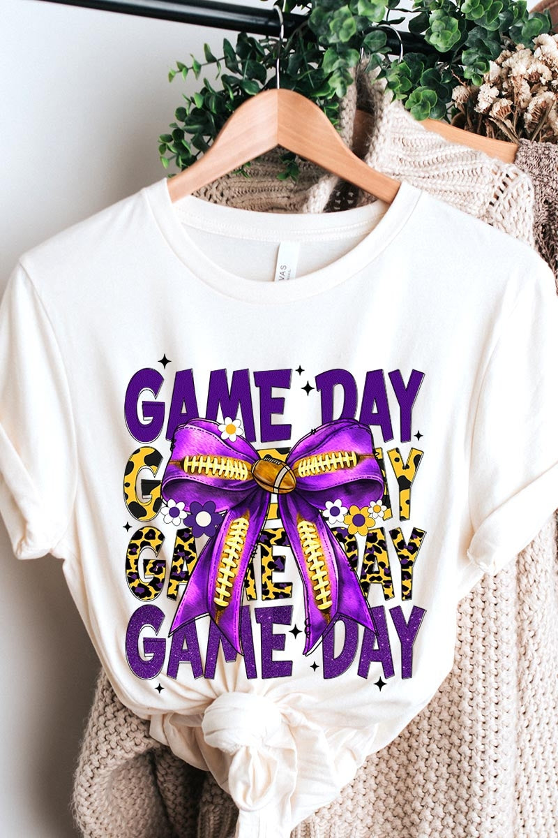 US3001-E3092 Purple Yellow Football Game Day Bow Graphic Tee $12.5