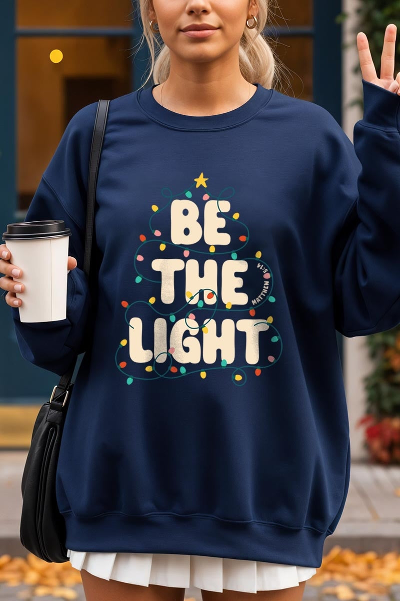 UL180-E3202 Be the Light Christmas Graphic Sweatshirt $20