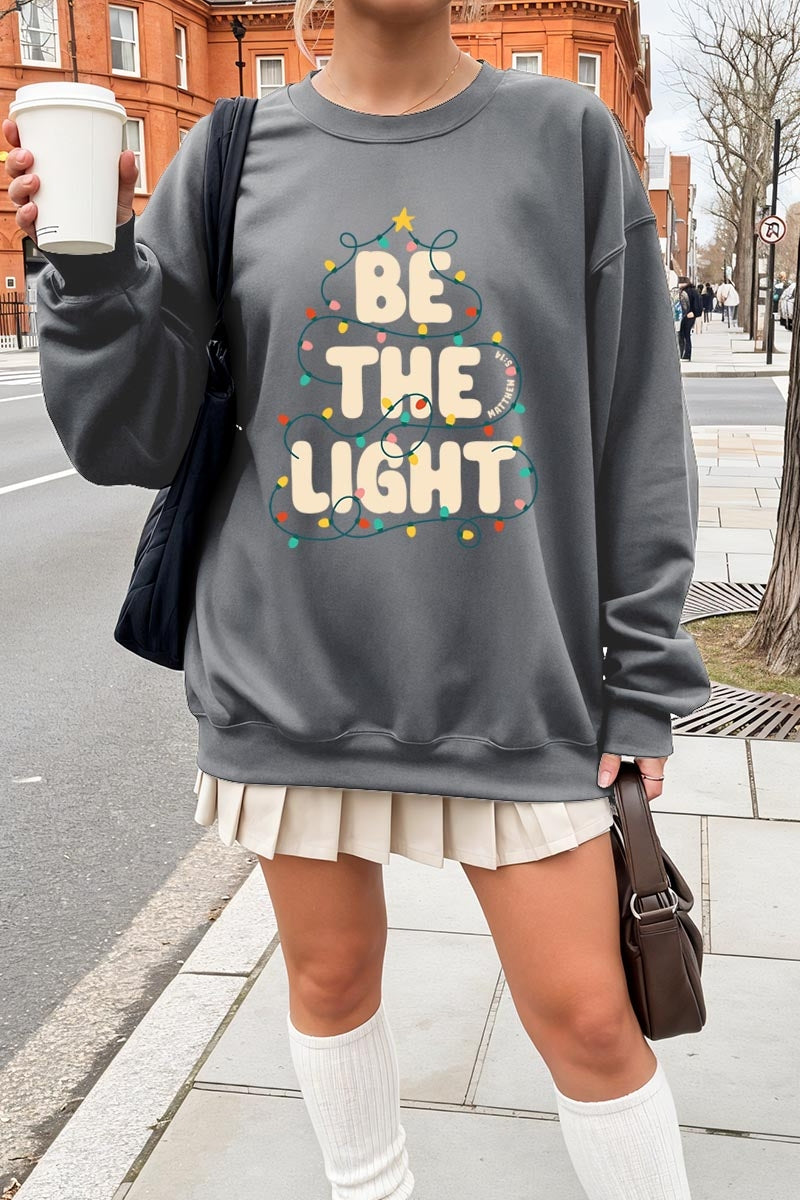 UL180P-E3202 Be the Light Christmas Graphic Plus Sweatshirt $25
