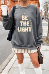 UL180P-E3202 Be the Light Christmas Graphic Plus Sweatshirt $25