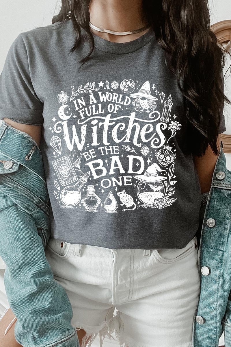 US3001P-E3139 In a World of Witches Graphic Plus Tee $16