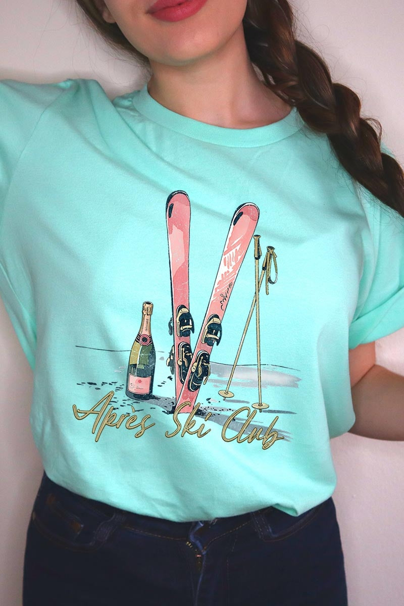 US3001-E3187 Apres Ski Club Graphic Tee $12.5